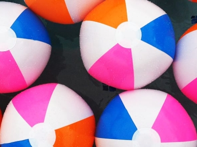 a group of brightly colored beach balls