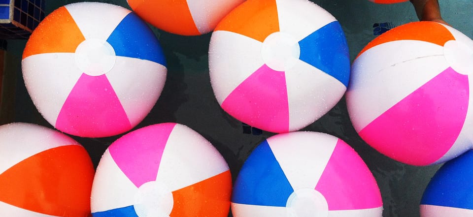 a group of brightly colored beach balls