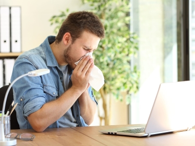 a man blowing his nose