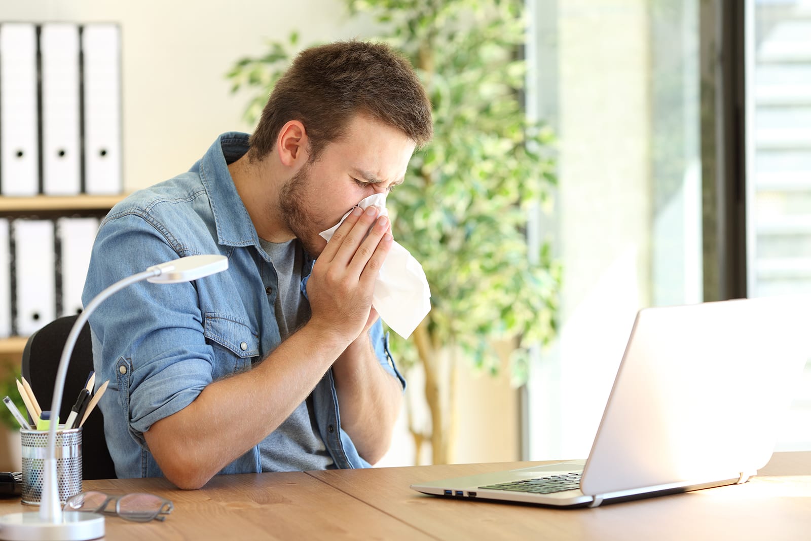 a man blowing his nose