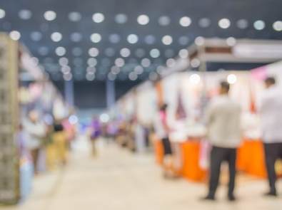 a blurry image of a trade show floor