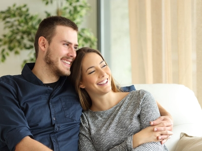 young couple sitting on a sofa