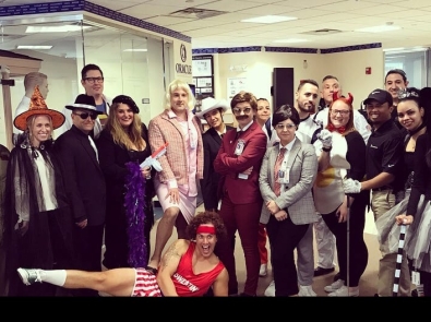 Planned employees in costume at a Halloween party