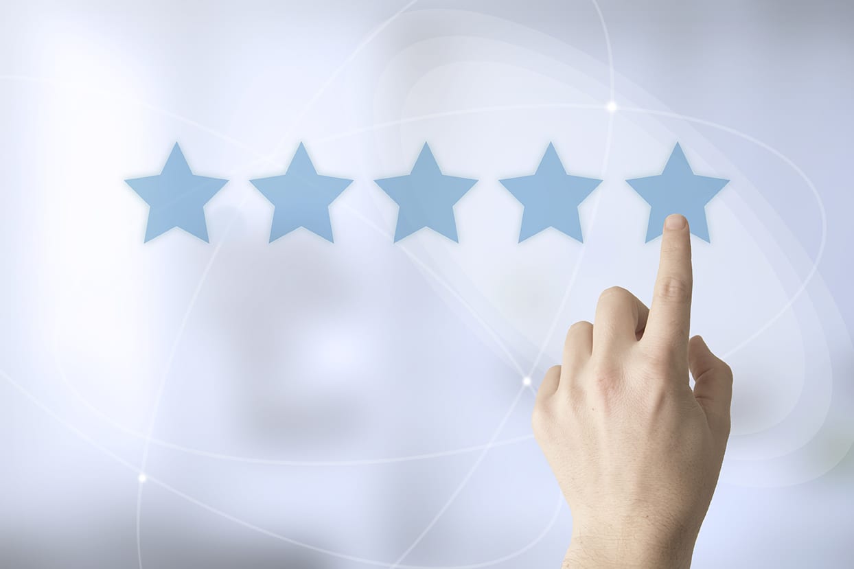 five stars with a finger pointing to the fifth star