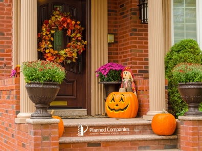 a doorstep with a Halloween pumpkin