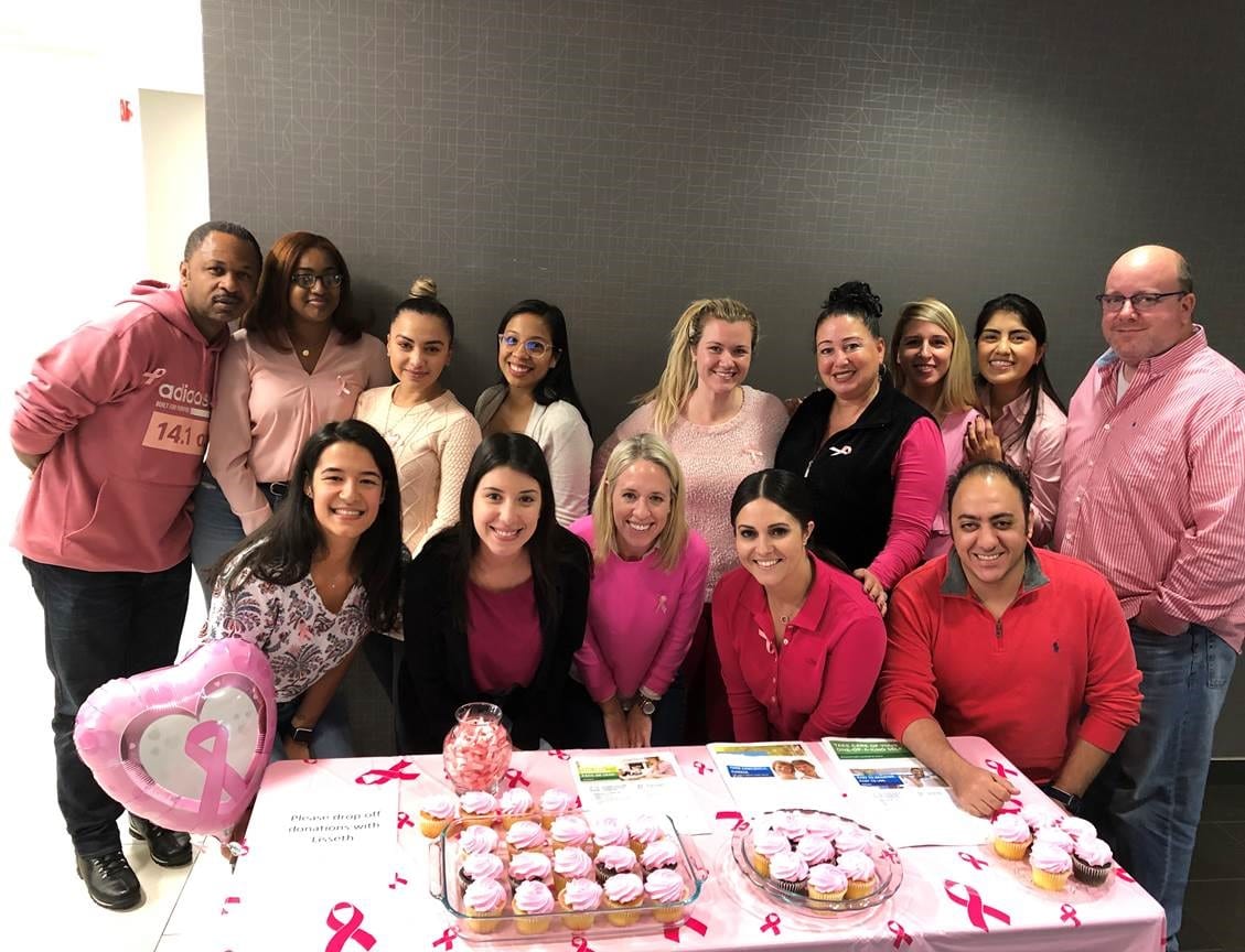 Planned employees at a breast cancer awareness event