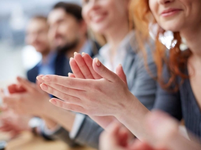 a group of people applauding